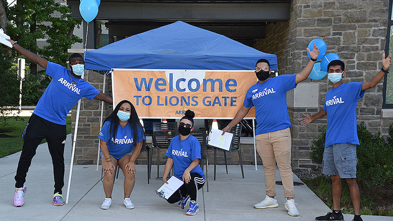students in front of Lions Gate