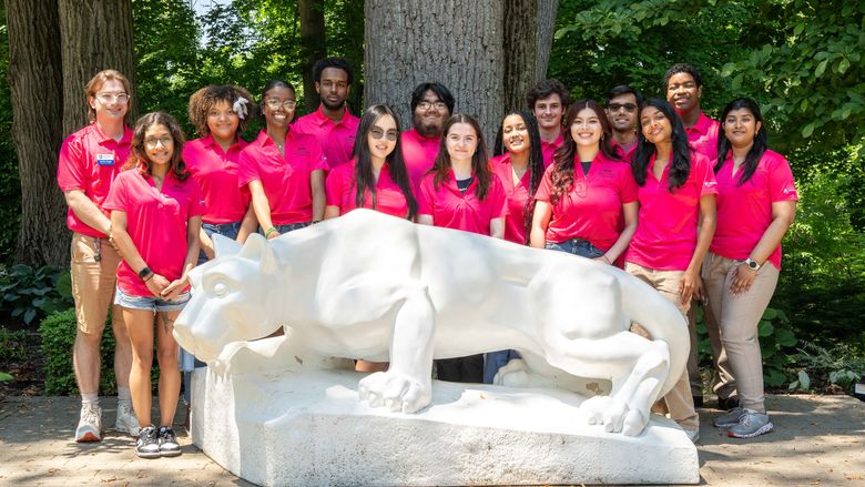 Group photo of Welcome Peer Leaders around Lion Shrine