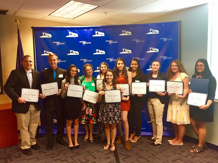 group of students pose with their awards