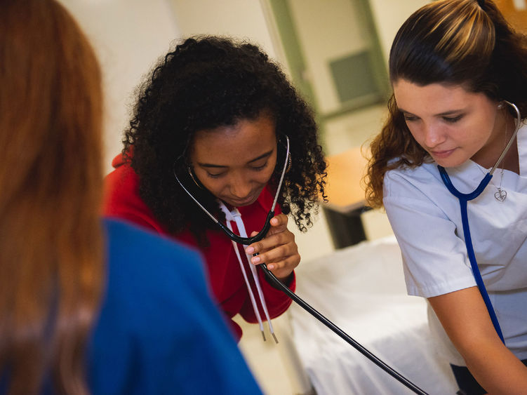 Nurses checking a patient