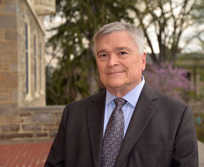 Portrait of Penn State President Eric Barron in front of Old Main on April 22, 2016.