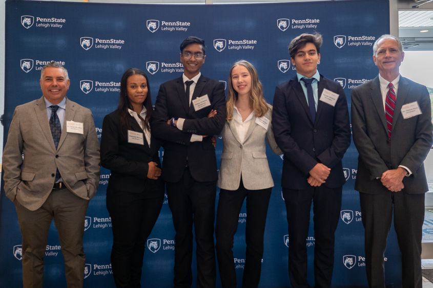 group of students and adviser