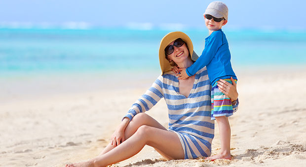 A woman and child on a beach