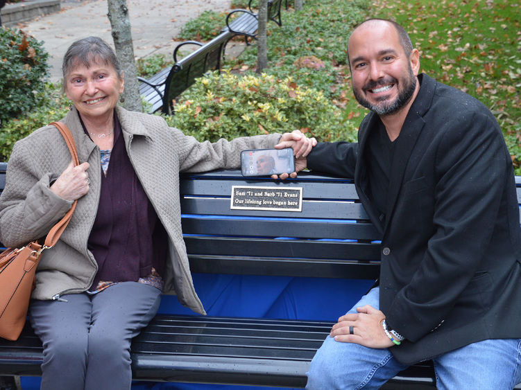Barb Evans and her son Brett and a bench dedication