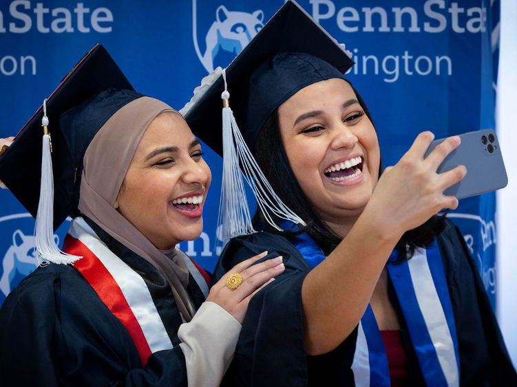 Two new Penn State Abington graduates take a selfie