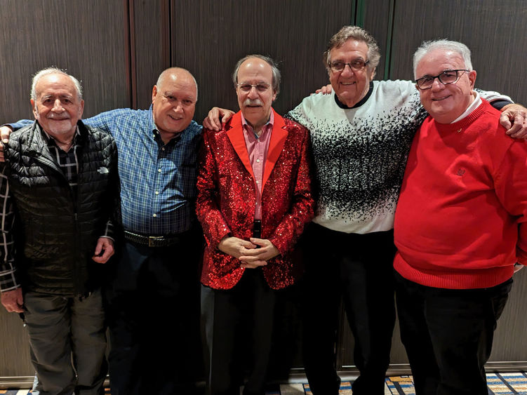 Five Penn State alumni dressed for a holiday party