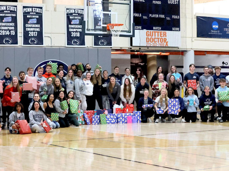 Penn State Abington student athletes wrapped gift for a family in need
